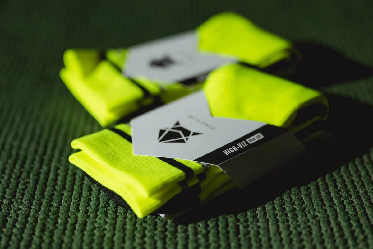 Incylence High-Viz Canary. Neon gröna löparstrumpor som håller dig fri från skav. Synliga i mörker.