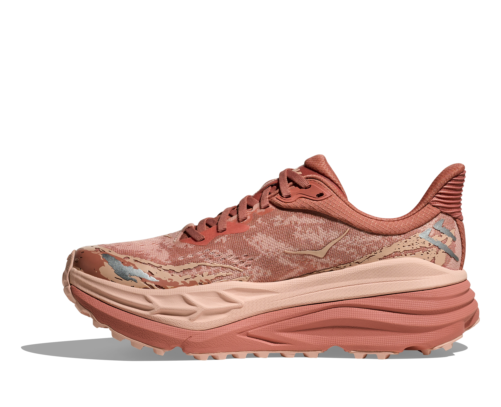  dammodell. Hybridsko för alla underlag. En av Hokas stabilaste skor med pronationsstöd. En väldämpad sko som avlastar rygg och knä. Färgen här är rosa och beige. 
