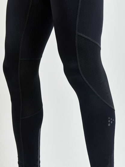 Craft ADV Essence Zip Tights. Svarta tights med elastiskt resår samt dragsko i midjan. Stor mobilficka höger ben. Ficka med dragkedja baktill. Dragkedja vid benslut. Reflekterande print baktill.