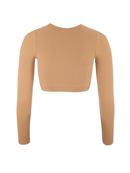  tight passform till dam för träning och vardagsliv. Mjukt stretchmaterial med ribbstruktur. Här i brun/beige nyans med vit Craft-etikett nedtill fram.