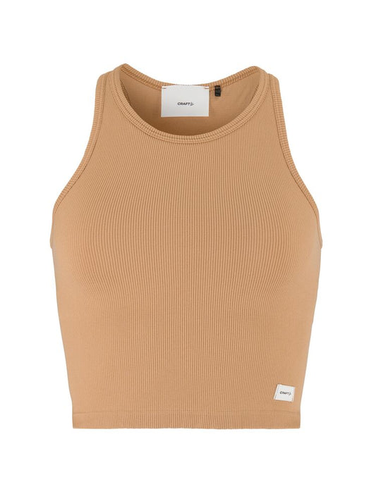 Craft Collective Rib Tank Top W. Sömnlös träningstopp i mjuk och ribbad kvalitet till dam. Kroppsnära passform och ribbad ytstruktur skapar skön och följsam känsla. Beige/brun nyans och med vit Craft etikett nedtill vänster fram. 
