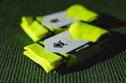 Incylence High-Viz Canary. Neon gröna löparstrumpor som håller dig fri från skav. Synliga i mörker.